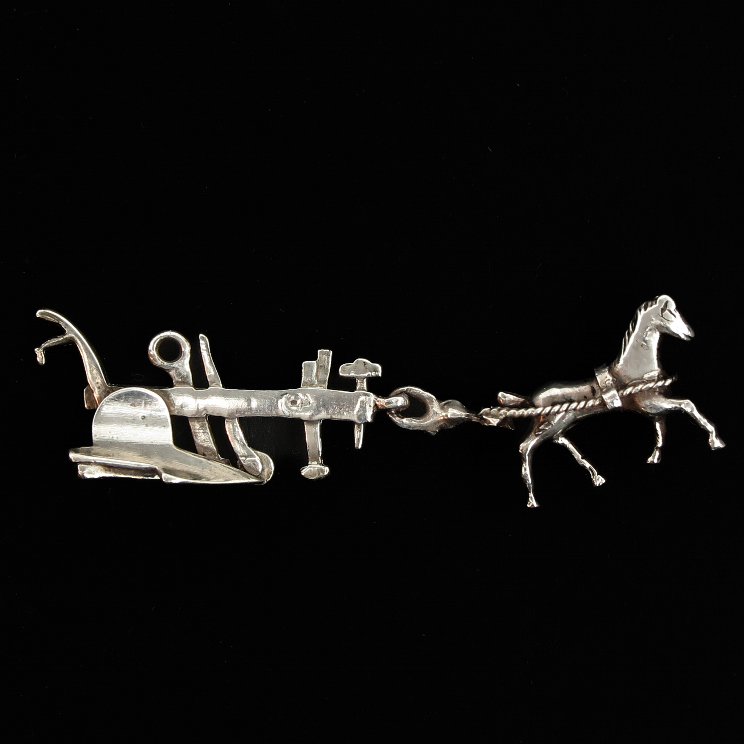 A Silver Miniature Horse and Plow